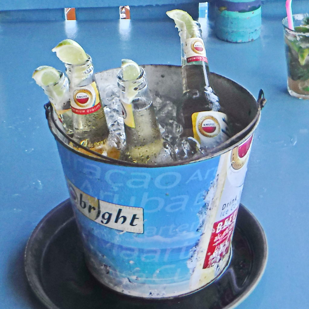 Nothing says Caribbean vacation better than an ice-cold bucket of beer at a beach bar.