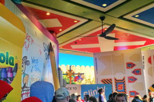 In the Slinky Dog Coaster queue, the walls are parts of the box the coaster came in, and the ceiling is a tic tac toe board.